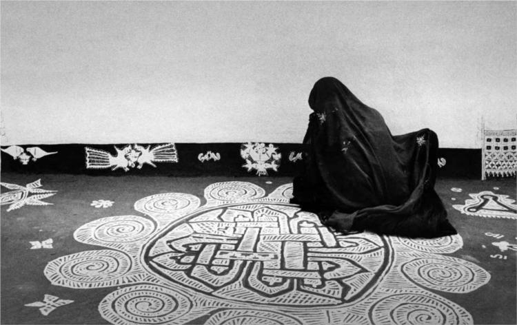 Woman drawing a mandana design, Rajasthan - Jyoti Bhatt